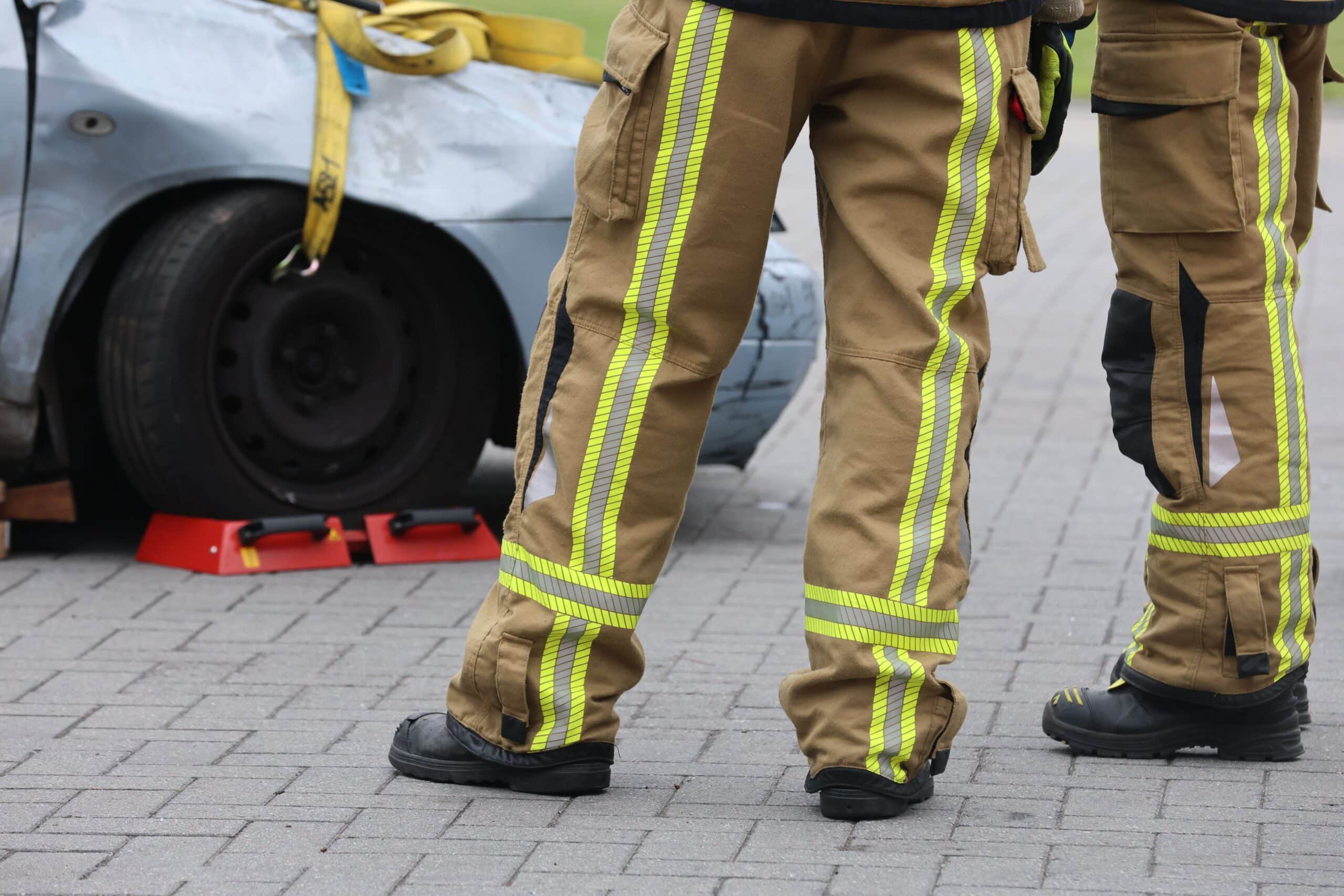 Firemen on the scene of an accident.